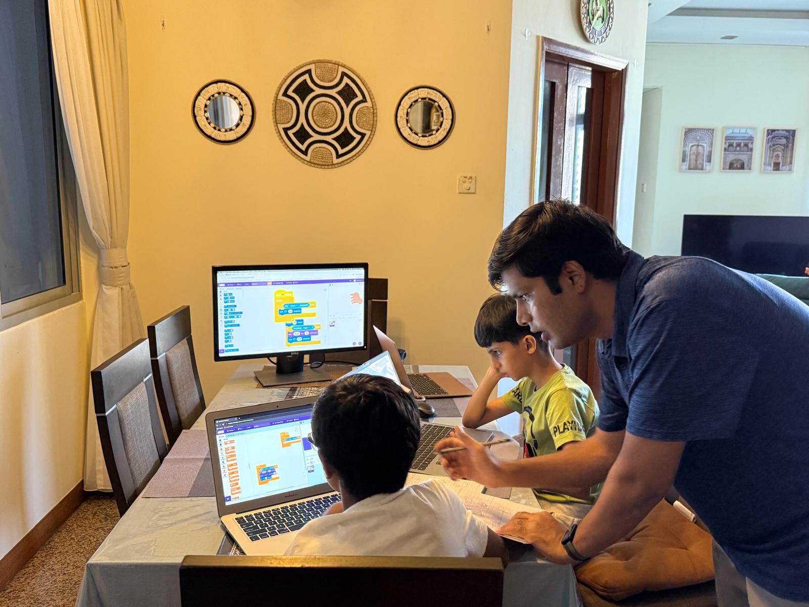 Instructor explaining concepts to kids